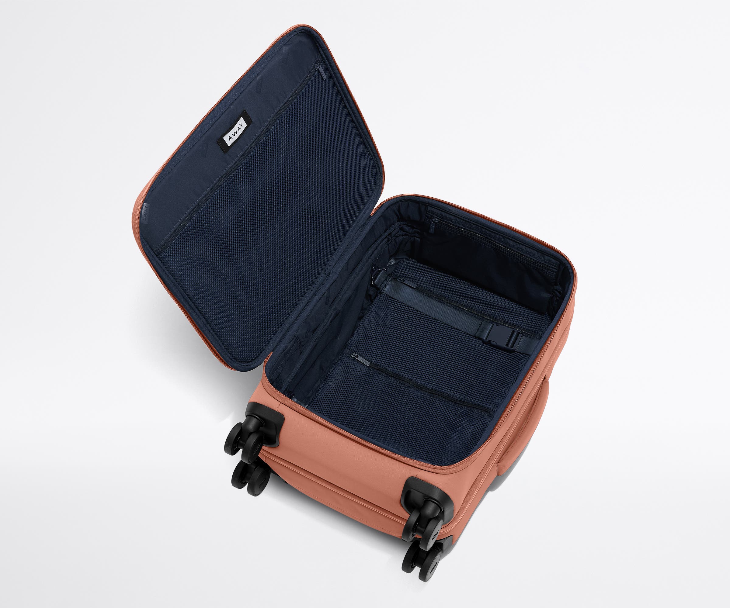 Open, unpacked Softside Carry-On, showing the depth of the bag and signature compression pad feature