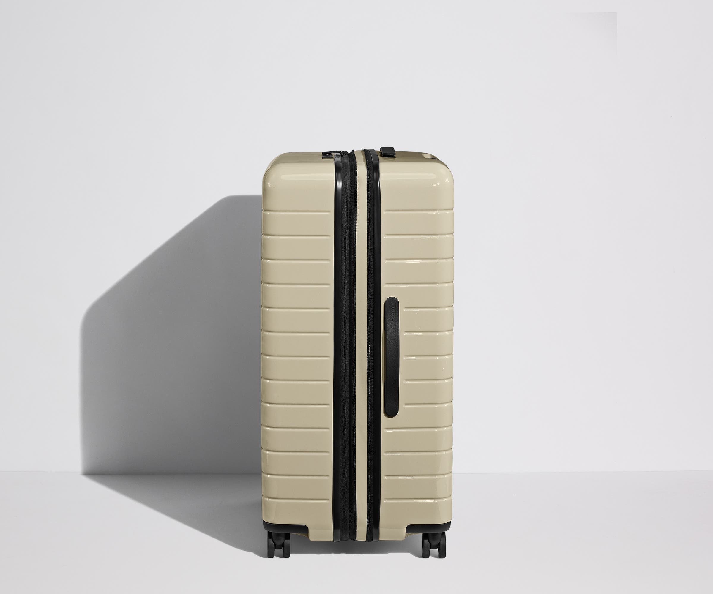 Side product view of The Large Flex suitcase shown fully expanded