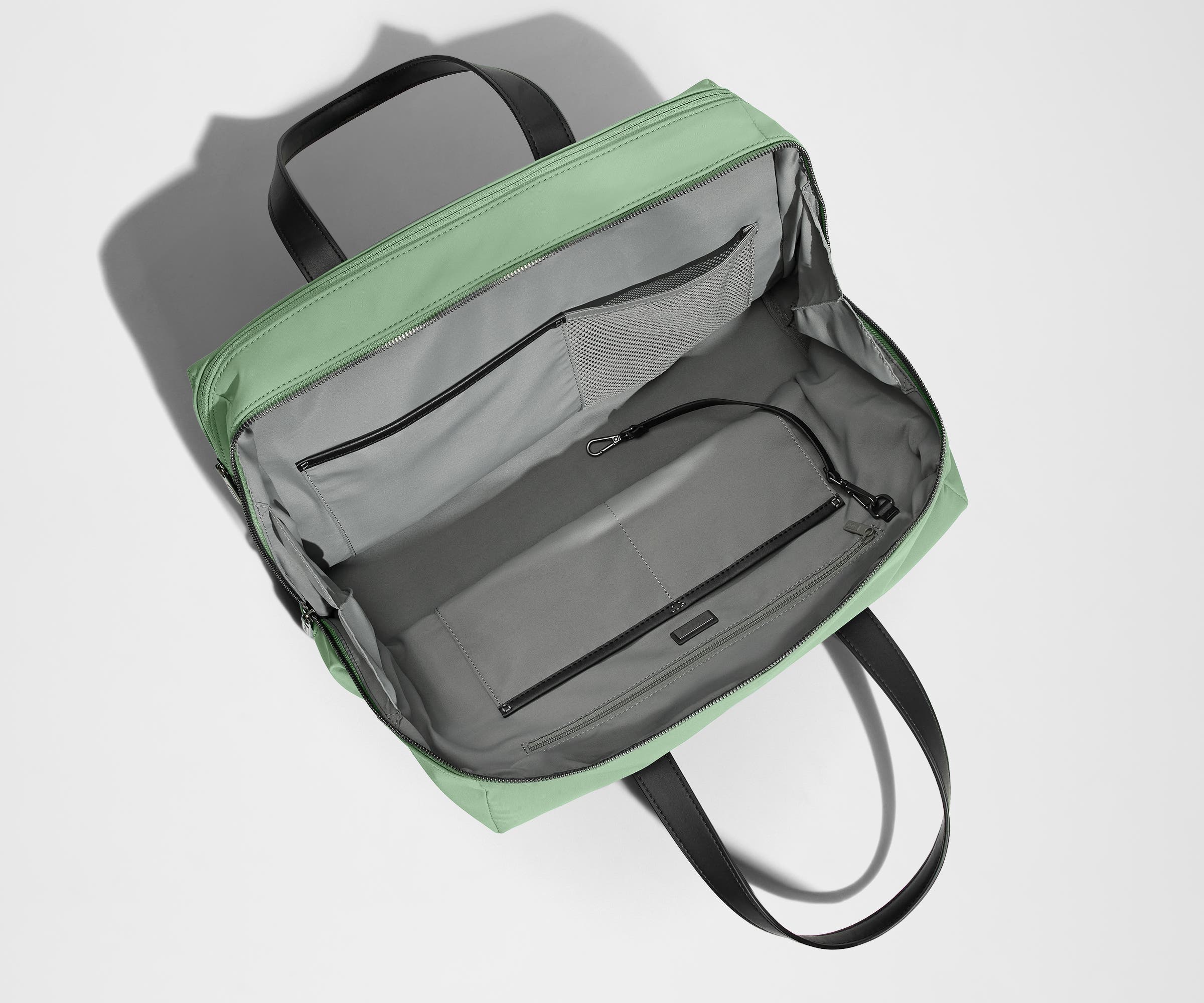 Empty Everywhere Bag, showing the interior organization with multiple slip pockets, zippered pocket, and key leash