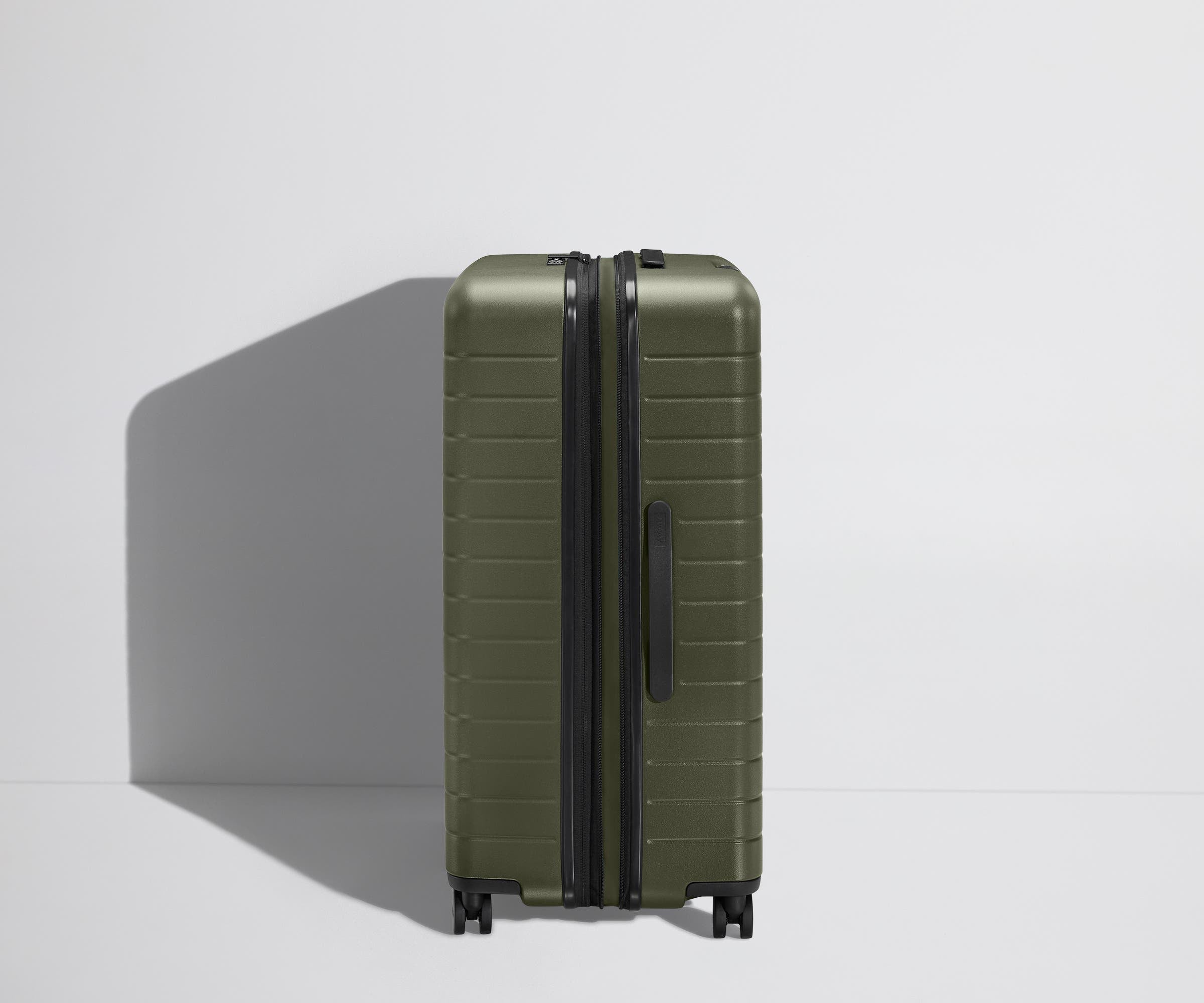 Side product view of The Large Flex suitcase shown fully expanded