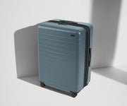 Angled product view of The Large Flex suitcase in Coast Blue