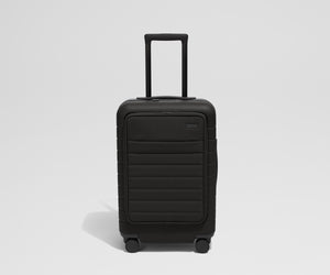 Front product view of The Front Pocket Carry-On suitcase in Jet Black with raised handle