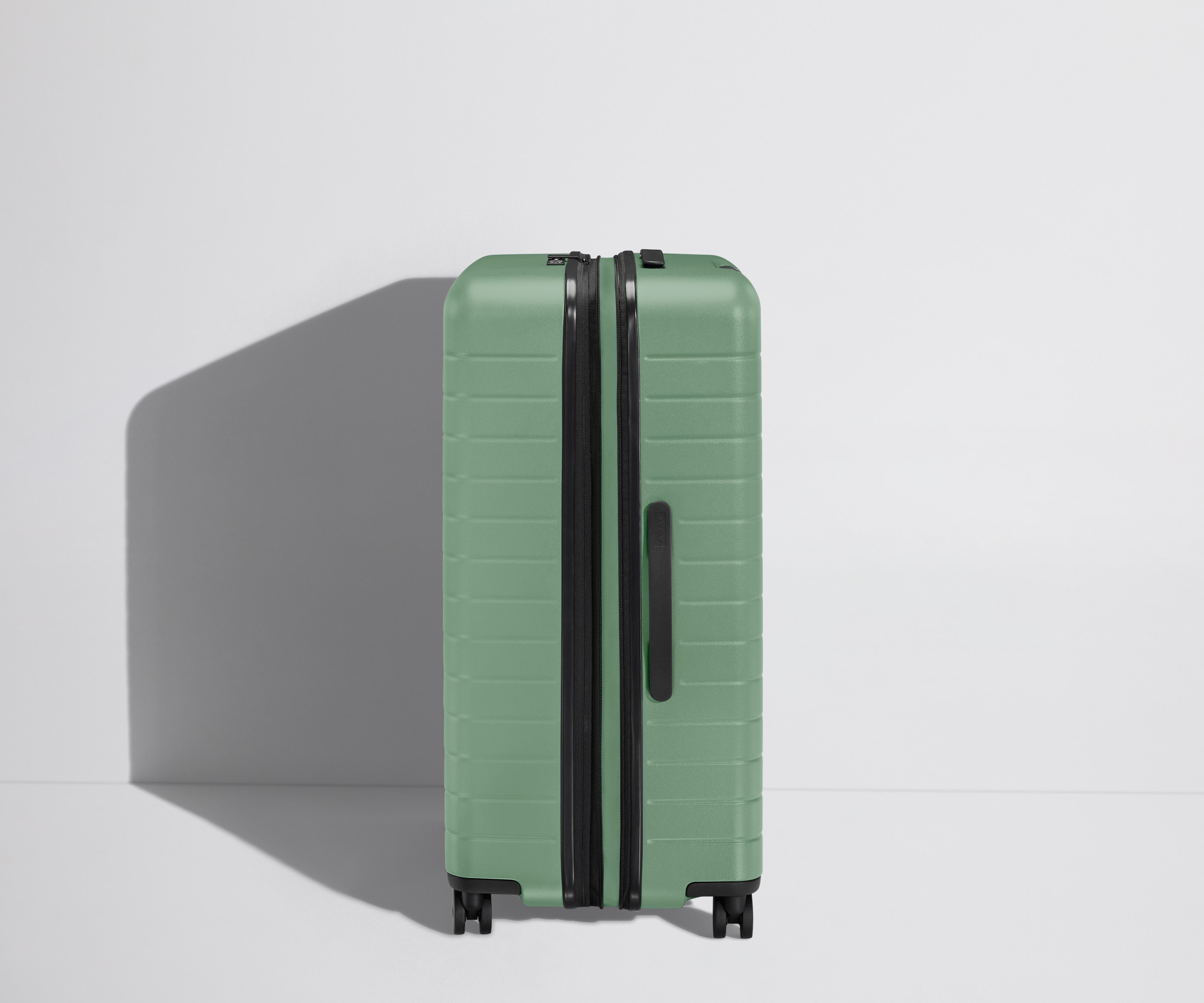 Side product view of The Large Flex suitcase shown fully expanded