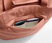 Phone and passport packed in an exterior zip pocket