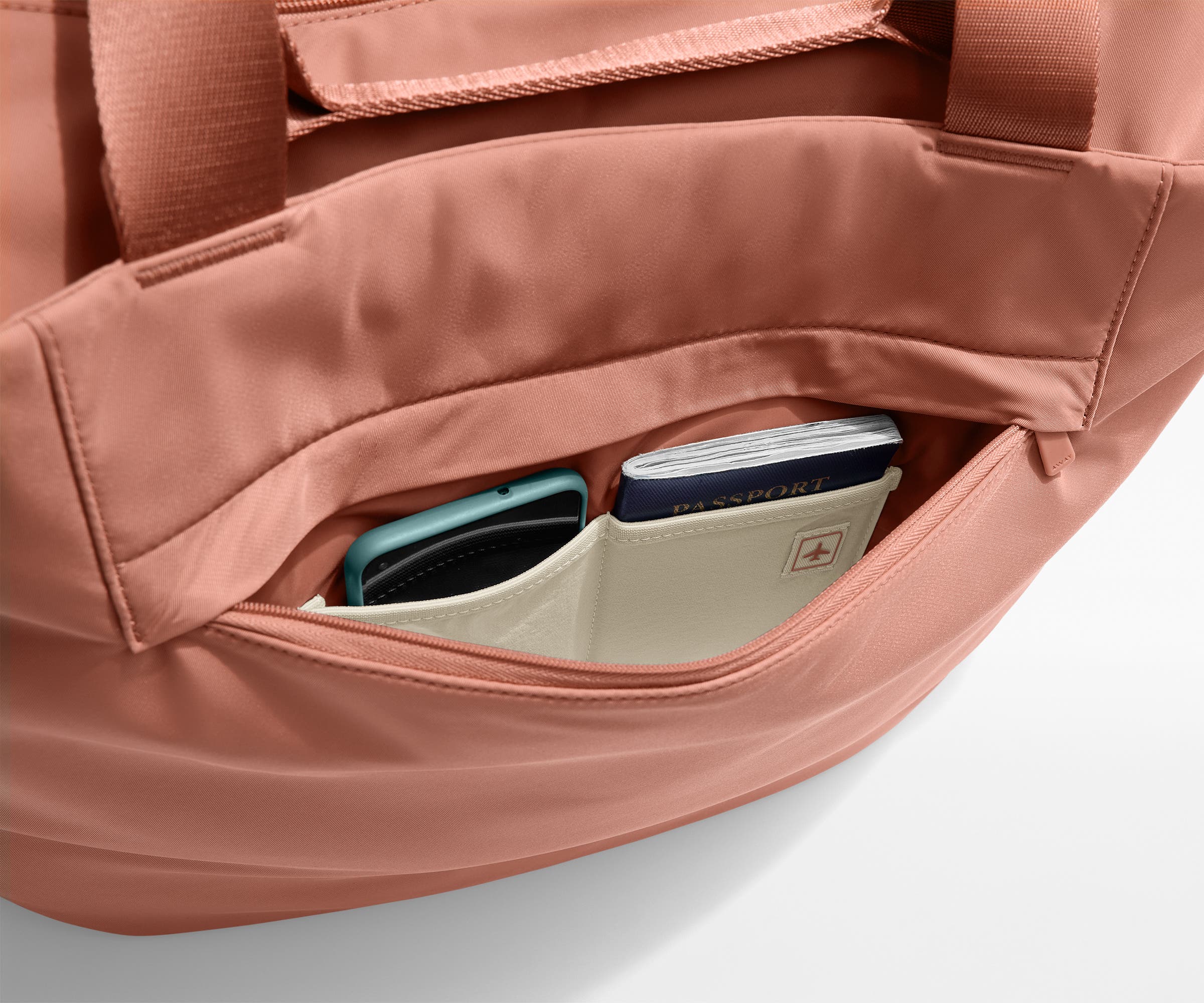 Phone and passport packed in an exterior zip pocket