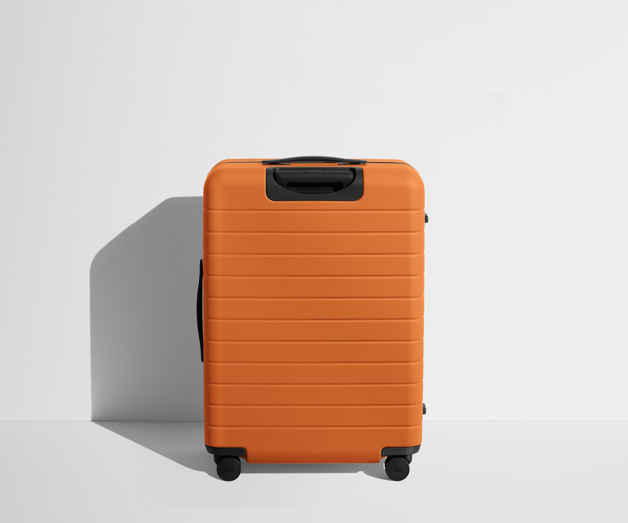 Back product view of The Medium suitcase in Sorbet Orange