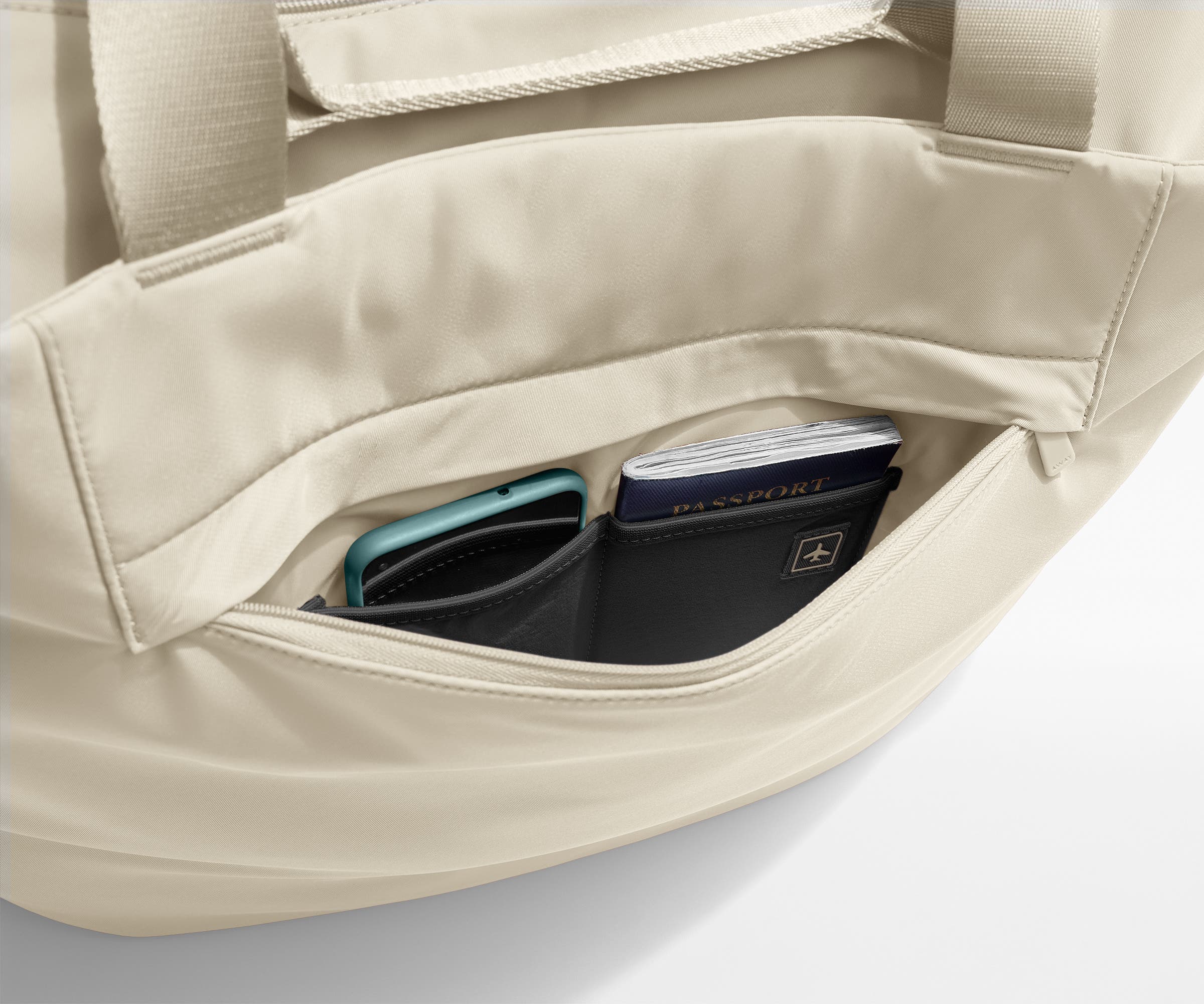 Phone and passport packed in an exterior zip pocket