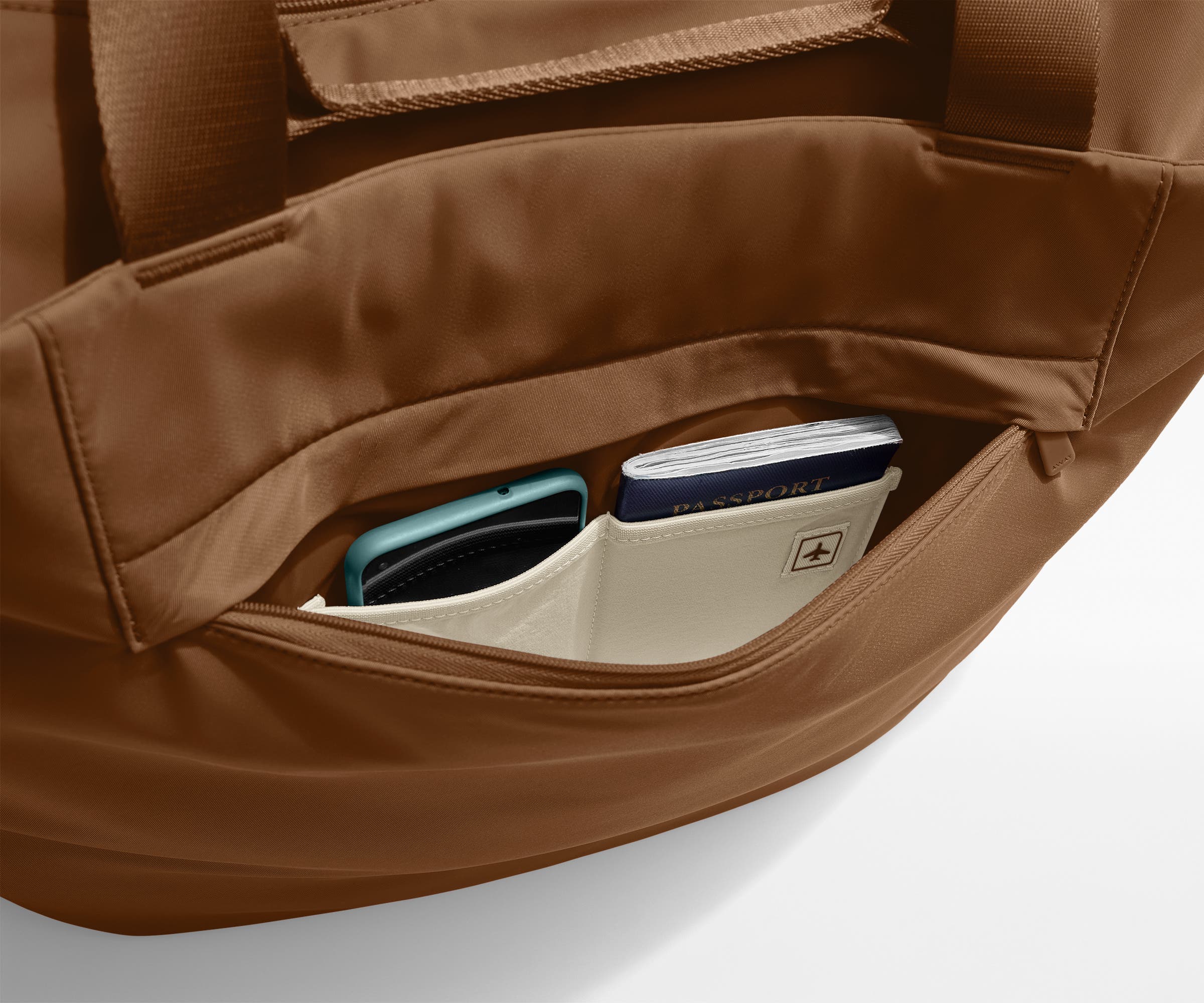 Phone and passport packed in an exterior zip pocket