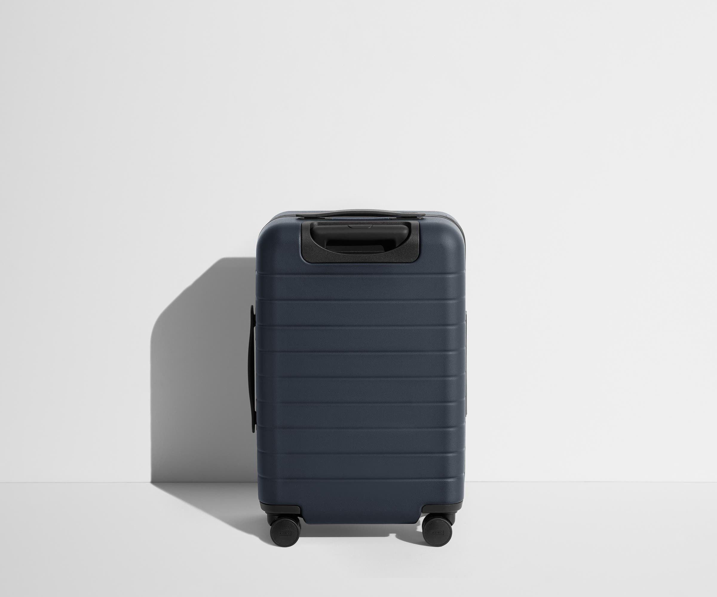 Back product view of The Carry-On suitcase in Navy Blue