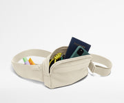 Sling Bag packed with a phone, passport, keys, and chapstick