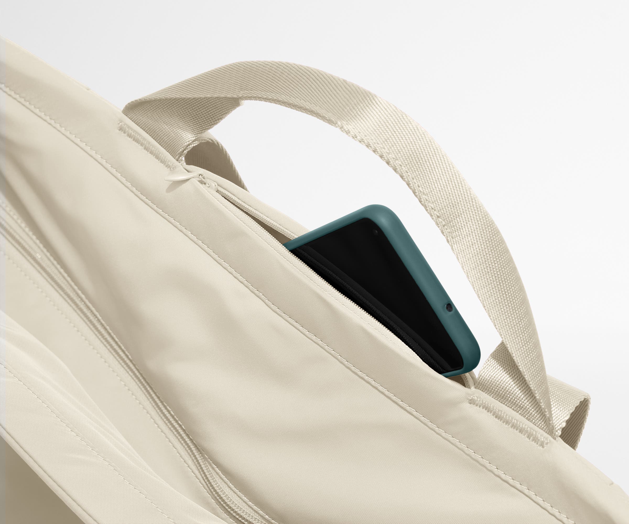 Phone shown in the hidden pocket between handles