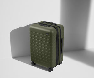 Angled product view of The Bigger Carry-On Flex suitcase in Olive Green