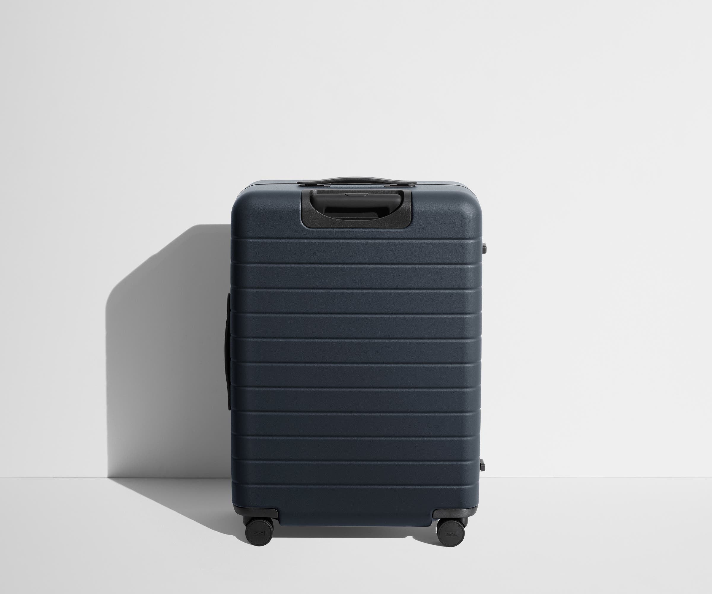 Back product view of The Medium suitcase in Navy Blue