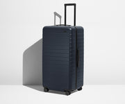 Angled product view of The Trunk suitcase in Navy Blue