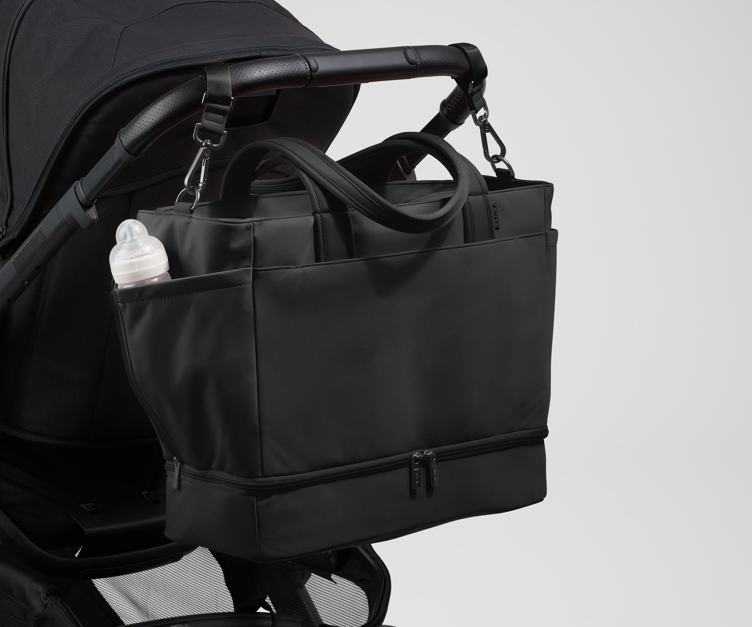 Tote attached to a stroller using the included stroller clips