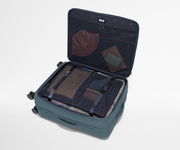 Open Softside suitcase, with travel essentials in the front flap pocket and compression pad pockets