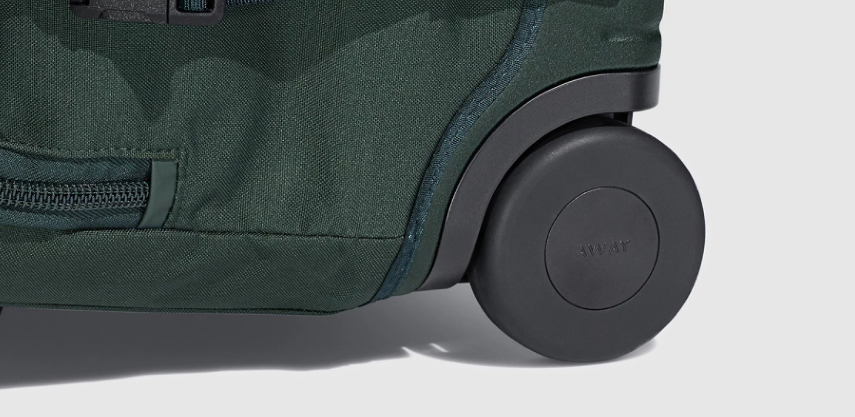 a close up shot of the wheel of the Away Active rolling duffle