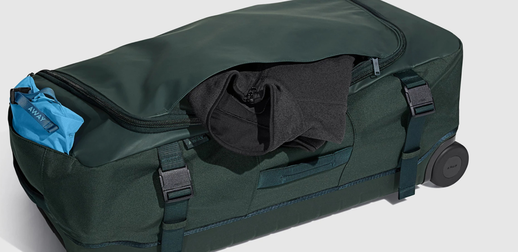 The Away rolling duffle with the top zipper open