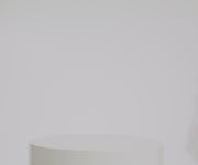 Person packing the Featherlight Weekender with various travel essentials