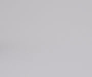 A video of a male model walking into frame twirling The Front Pocket Bigger Carry-On suitcase in Coast Blue to showcase the smooth 360° wheels and releasing the high-grade, quick-release trolley handle into position